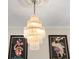 Close-up of an intricate, tiered crystal chandelier in a dining area at 3325 Spring Mill Cir, Sarasota, FL 34239