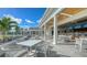 Elegant outdoor patio with seating and bar view at 385 N Point Rd # 404, Osprey, FL 34229