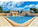 Community pool with plenty of lounge chairs for relaxing at 4001 Beneva Rd # 409, Sarasota, FL 34233