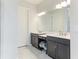 Modern bathroom with double vanity and walk-in shower at 4707 Arpino Ct, Bradenton, FL 34211