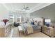 Spacious primary bedroom with a plush carpet and large windows at 4707 Arpino Ct, Bradenton, FL 34211