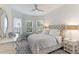 Serene guest bedroom with a comfy bed and lots of natural light at 4707 Arpino Ct, Bradenton, FL 34211