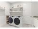 Convenient laundry room with side-by-side washer and dryer at 4707 Arpino Ct, Bradenton, FL 34211