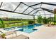 Enclosed pool and spa area with a tranquil water feature at 4707 Arpino Ct, Bradenton, FL 34211