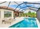 Enjoy this relaxing pool and spa with a covered patio and luxurious lounge chairs at 4707 Arpino Ct, Bradenton, FL 34211