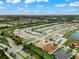 Aerial view of house in a neighborhood at 4905 Avila Lakes Dr, Wimauma, FL 33598