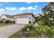 Home exterior with landscaped yard at 4905 Avila Lakes Dr, Wimauma, FL 33598