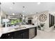 Modern kitchen features granite countertops, stainless steel appliances, and an island at 4905 Avila Lakes Dr, Wimauma, FL 33598
