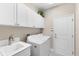 Laundry room with washer, dryer, and cabinets at 4905 Avila Lakes Dr, Wimauma, FL 33598