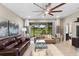 Spacious living room with patio access and ceiling fan at 4905 Avila Lakes Dr, Wimauma, FL 33598