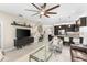 Bright living room features large windows, comfortable seating, and an open floor plan at 4905 Avila Lakes Dr, Wimauma, FL 33598