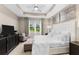 Large main bedroom with a plush bed, a ceiling fan, and plenty of natural light at 4905 Avila Lakes Dr, Wimauma, FL 33598