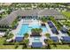 Aerial view of community pool and clubhouse at 4905 Avila Lakes Dr, Wimauma, FL 33598