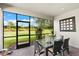 Screened porch with patio furniture at 4905 Avila Lakes Dr, Wimauma, FL 33598