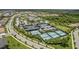 Aerial view of tennis and pickleball courts at 4905 Avila Lakes Dr, Wimauma, FL 33598