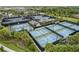 Aerial view of community tennis and pickleball courts at 4905 Avila Lakes Dr, Wimauma, FL 33598