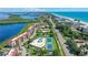 Aerial view of community, pool, tennis courts, and beach access at 4960 Gulf Of Mexico Dr # 206, Longboat Key, FL 34228