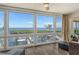 Living room with wall-to-wall windows and water views at 4960 Gulf Of Mexico Dr # 206, Longboat Key, FL 34228