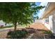 Backyard featuring a deck and lush landscaping at 532 Altair Rd, Venice, FL 34293