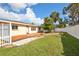 Large backyard with deck, landscaping, and storage shed at 532 Altair Rd, Venice, FL 34293