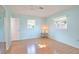 Light blue bedroom with wood floors and a ceiling fan at 532 Altair Rd, Venice, FL 34293