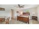 Bedroom with wooden furniture and a small dining area at 5576 Contento Dr, Sarasota, FL 34242