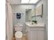 Clean bathroom with white vanity, toilet, and shower at 6029 E Peppertree Way # 116, Sarasota, FL 34242