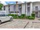 White brick building with paver parking and landscaping at 6029 E Peppertree Way # 116, Sarasota, FL 34242