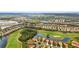 Beautiful aerial shot of a residential area next to a golf course at 608 Misty Pond Ct, Bradenton, FL 34212