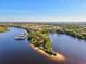 Aerial view of waterfront community with marina and lush landscaping at 608 Misty Pond Ct, Bradenton, FL 34212