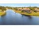Home with screened-in patio overlooking a lake at 608 Misty Pond Ct, Bradenton, FL 34212