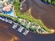 Aerial view of community amenities including marina, pool, and boat docks at 608 Misty Pond Ct, Bradenton, FL 34212