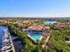 Aerial view of clubhouse with pool, boat dock and surrounding homes at 608 Misty Pond Ct, Bradenton, FL 34212
