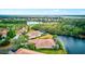 Scenic aerial view of waterfront community, lake and golf course at 608 Misty Pond Ct, Bradenton, FL 34212