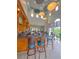Clubhouse bar with stylish seating and contemporary lighting at 608 Misty Pond Ct, Bradenton, FL 34212
