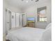 Bright guest bedroom with a comfortable bed and TV at 608 Misty Pond Ct, Bradenton, FL 34212