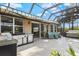 Outdoor kitchen with stainless steel appliances and patio seating at 608 Misty Pond Ct, Bradenton, FL 34212