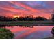 Beautiful sunset view over the water and golf course at 608 Misty Pond Ct, Bradenton, FL 34212