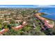 Aerial view of waterfront community with numerous buildings and lush landscaping at 6462 Wild Oak Bay Blvd # 247, Bradenton, FL 34210