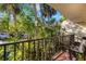 Private balcony overlooking lush tropical landscaping at 6462 Wild Oak Bay Blvd # 247, Bradenton, FL 34210