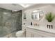 Updated bathroom, featuring a walk-in shower, toilet, and vanity with gold accents at 6462 Wild Oak Bay Blvd # 247, Bradenton, FL 34210