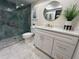 Modern bathroom with a large walk-in shower and white vanity at 6462 Wild Oak Bay Blvd # 247, Bradenton, FL 34210