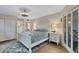 Serene bedroom with king-size bed and private balcony access at 6462 Wild Oak Bay Blvd # 247, Bradenton, FL 34210