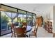 Cozy dining area with round table and four chairs, near sliding glass doors at 6462 Wild Oak Bay Blvd # 247, Bradenton, FL 34210