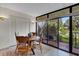 Bright dining area with round table and four chairs, and access to a patio at 6462 Wild Oak Bay Blvd # 247, Bradenton, FL 34210