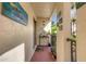 Condo entry with decorative tile and potted plants at 6462 Wild Oak Bay Blvd # 247, Bradenton, FL 34210
