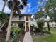 Two-story condo with lush landscaping and a welcoming entryway at 6462 Wild Oak Bay Blvd # 247, Bradenton, FL 34210