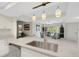 Modern kitchen with stainless steel appliances and white cabinetry at 6462 Wild Oak Bay Blvd # 247, Bradenton, FL 34210
