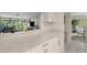 White kitchen with quartz countertops and breakfast bar at 6462 Wild Oak Bay Blvd # 247, Bradenton, FL 34210