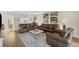 Living room with brown leather sofas and a coffee table at 6462 Wild Oak Bay Blvd # 247, Bradenton, FL 34210